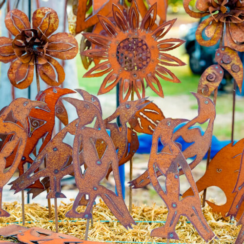 Metal sculptures of flowers and birds