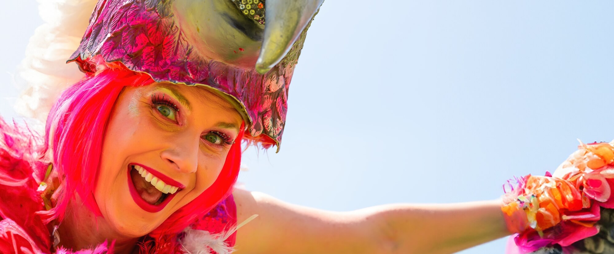 Woman in a pink costume with a bird head